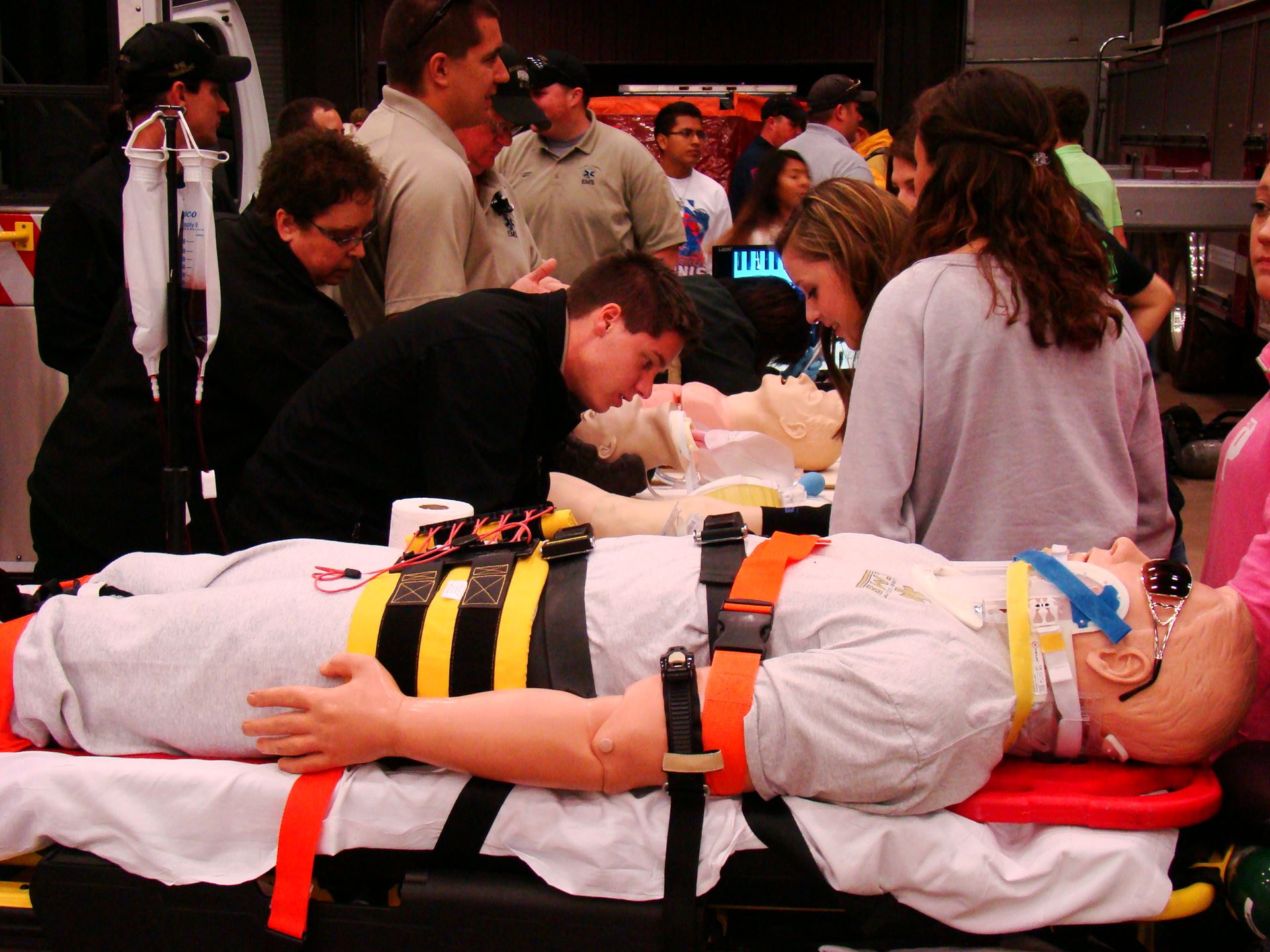 Students explore EMS training equipment.
